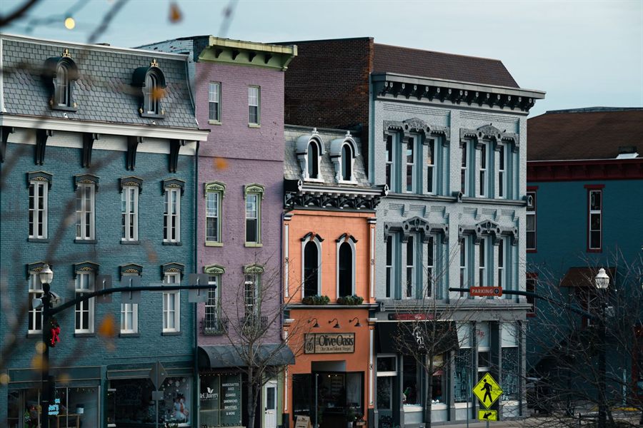 Row of main-street storefronts with ground-floor retail